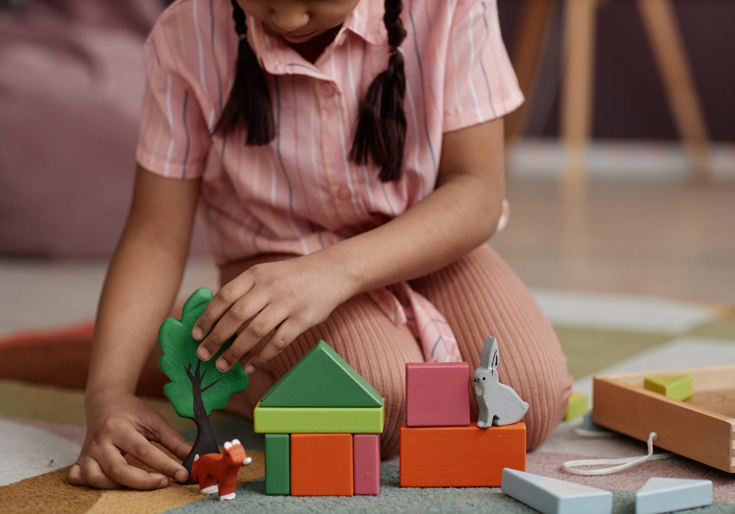 Close,Up,Little,Girl,Playing,With,Wooden,Toys,And,Building